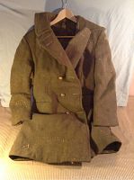 Full front view of heavy wear brown wool prison guard jacket on hanger showing overall condition and length.