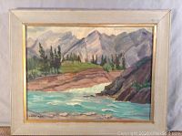 Front view of the framed oil painting depicting Bow Falls Alberta by L. Breckon.