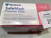 Box front showing Medicom SafeMask Premier Elite branding with ASTM Level 3 certification and Made in USA text