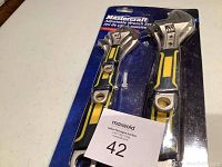 Photo of Mastercraft adjustable wrench set in original packaging showing two wrenches visible in blister pack, identification tag in front.