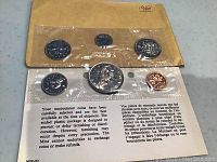 1968 Canadian uncirculated coin set in original sealed plastic packaging mounted on cardboard.