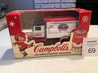 Front view of the boxed Campbell Soup Company 1931 Hawkeye delivery truck bank with colorful packaging and branding.