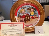 Framed Campbell's Vegetable Beef Soup collectible plate with 23 karat gold decoration, showing vintage children illustration, includes certificate of authenticity displayed in front.