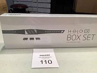 Front view of sealed original HeloWorld Box Set Wellness Band packaging showing product image and branding.