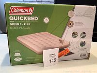 Front of Coleman Quickbed box showing full/double size air mattress image and main branding.