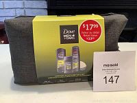 Box of Dove Men+Care Complete Sport+Care gift set featuring body and face wash, shampoo, conditioner, anti-perspirant and shower tool.