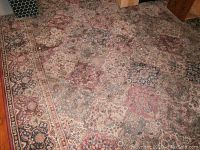 Full view of the family room rug showing patchwork design and colors