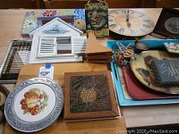 Full view of collection showing multiple wall decor pieces and cutting boards on a table