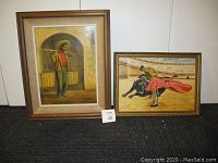 Two framed oil paintings side by side: one of a man carrying water containers, the other of a bullfighter with red cape and bull.
