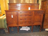 Front view of sideboard showing drawer layout and cabinet doors