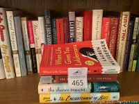 Books arranged on a shelf, showing front and spines of various titles including When Life Gives You Lululemons and The Age of Innocence.
