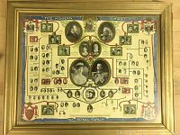 Full view of the framed Royal Family tree chart showing portraits and genealogical layout
