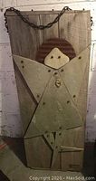 Full view of the large wooden garden art piece showing overall dimensions and mixed media abstract figure.