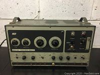 Full front view of vintage B&K Model 1076 Television Analyst machine showing entire front panel with various dials and switches.