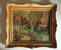 Front view of framed oil landscape painting showing birch trees, river and foliage in textured brush strokes.