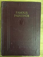 Front cover of antique book 'Famous Paintings' with maroon cloth and gold embossed title and design.