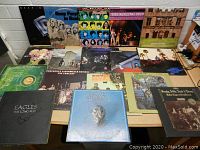 Overview of 17 vinyl LPs arranged on table