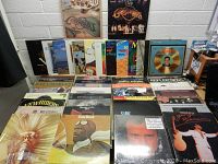 Twenty albums laid out facing forward in rows; front covers visible