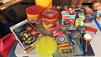 Overview of vintage Playskool toys, buckets, blocks, audio items, and tote