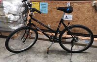 Full left-side view of Trek Mountain Track 830 mountain bike, black frame, front and rear wheels and drivetrain visible.