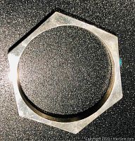 Top-down view of the hexagonal sterling silver bangle bracelet showing six flat sides and polished finish.
