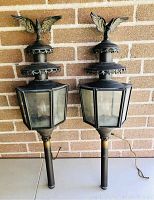 Both fixtures side by side against brick wall