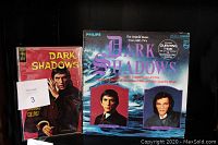 Photo showing the 1969 Dark Shadows comic book with Barnabas Collins on the cover and the Dark Shadows vinyl record featuring original music from ABC-TV's Dark Shadows series, with images of lead characters.
