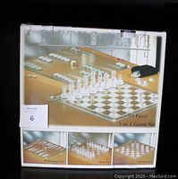 Box top showing Fifth Avenue Ltd. Crystal brand 95-piece 3-in-1 game set including chess, backgammon, and checkers.