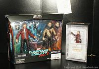 Photo of both the Marvel Legends Guardians of the Galaxy Vol. 2 action figure double pack featuring Star-Lord and Marvel's Ego new in box, alongside the limited edition, numbered Star-Lord figurine with its box and certificate.