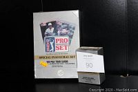 Five sealed sets of PGA Tour Special Inaugural Pro Set trading cards shown stacked in their shrink-wrapped packaging with label on one box.