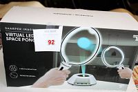 Box front showing branding and game image of two paddles and virtual LED ball