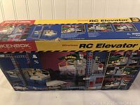 Front view of the Rokenbok Wireless RC Elevator boxed set showing the assembled elevator and vehicle on the packaging.