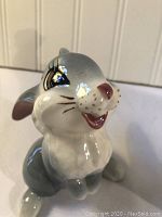 Close-up of gray Thumper ceramic rabbit figurine showing facial details and glossy finish