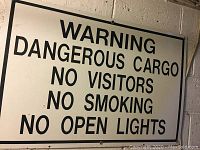Full front view of the large vintage warning sign with text content visible