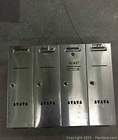 Top-down photo showing all four mailbox compartments with locks, slots, and ventilation cutouts