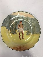 Full view of the scalloped Royal Doulton plate with central figure and woodland scenery
