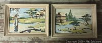 Pair of vintage paint by number paintings in light wood frames showing Asian-style landscapes with water and birds.