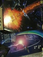 Three photos showing different Star Trek movie posters including Star Trek VI and Star Trek Generations.
