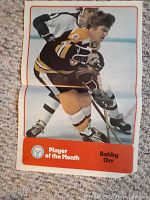 Color poster of Bobby Orr in Boston Bruins jersey labeled Player of the Month.