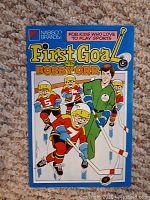 Front cover of the vintage 'First Goal with Bobby Orr' comic book from Nabisco, showing hockey players in action.