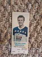 Front side of the hockey card featuring Tom Williams in Minnesota jersey with NHL stats and season information.