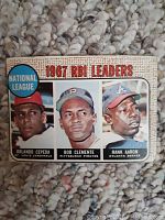 Front side of 1967 National League RBI Leaders baseball card featuring portraits of Orlando Cepeda, Bob Clemente, and Hank Aaron with the title and team info.