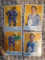 Four hockey cards featuring Garry Monahan, Mike Pelyk (two copies), and Darryl Seaby, front side showing players in uniform with yellow backgrounds.