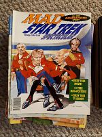 Stack of Mad magazines with top visible edition: Mad Star Trek Special Holiday 1994 showing caricatured Star Trek characters.
