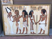 Large framed oil painting depicting five Egyptian figures dressed in traditional garments with hieroglyphic inscriptions above, measuring at least 3.5 feet by 5 feet.