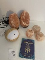 Full overview of all items together showing two salt lamps, three votive holders, diffuser, and book