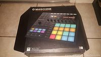 Original box of Native Instruments Maschine MK3 controller showing colorful illuminated pads on image.