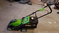 Full left side view of Greenworks cordless mower with grass catcher attached