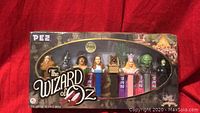 Wizard of Oz themed PEZ collection in original display box showing front with all seven character dispensers visible