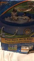 Front of box showing Summer Escapes Quick Set Up pool with promotional image